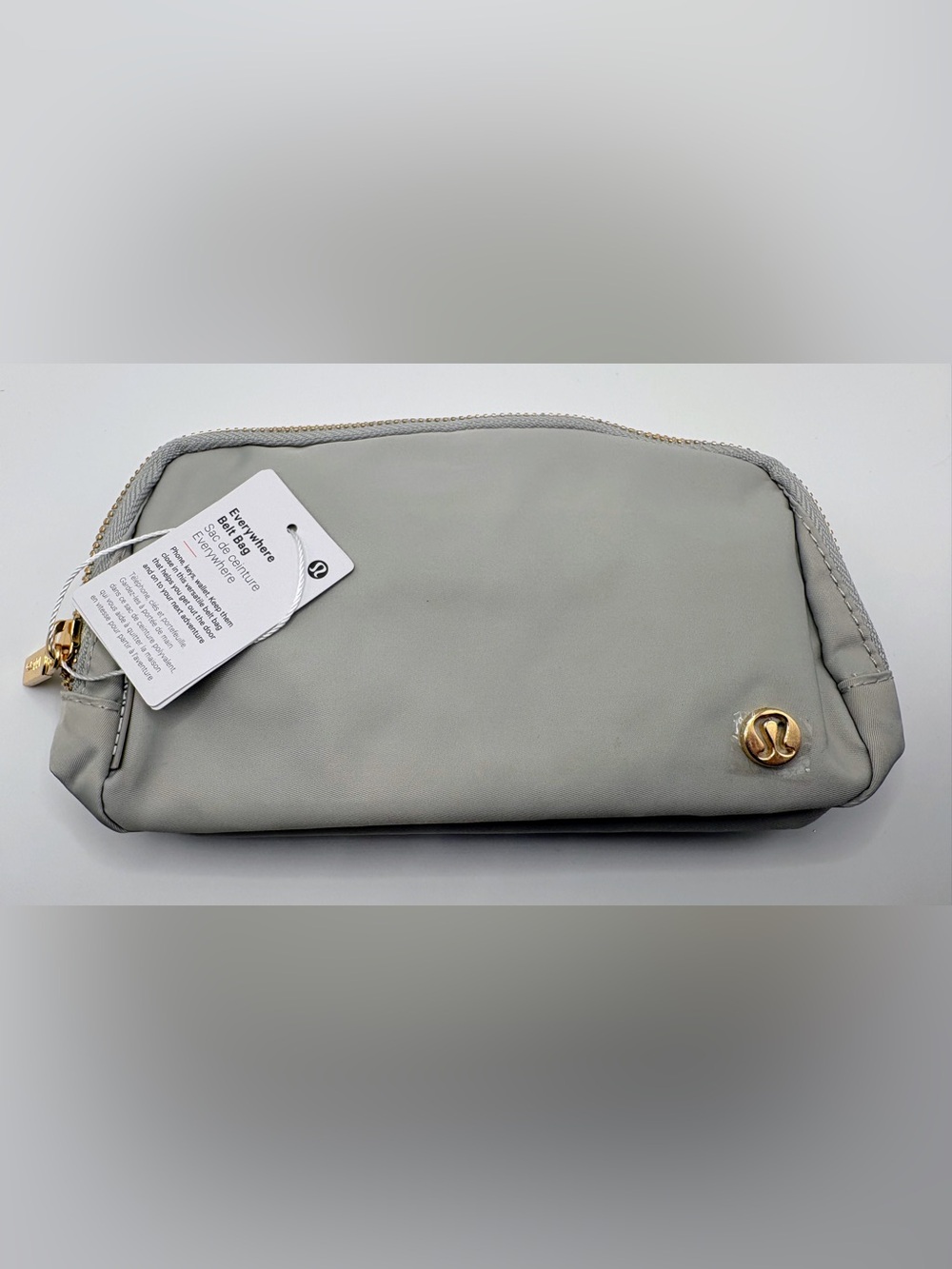 NWT lululemon athletica Light Gray Cosmetic Pouch with Gold Accent